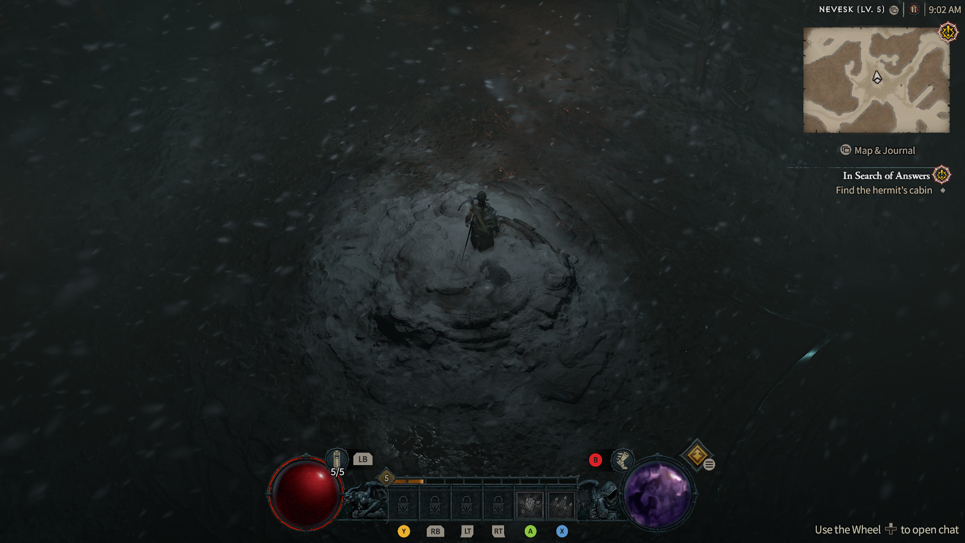 A rogue standing in a snowstorm in Diablo 4.
