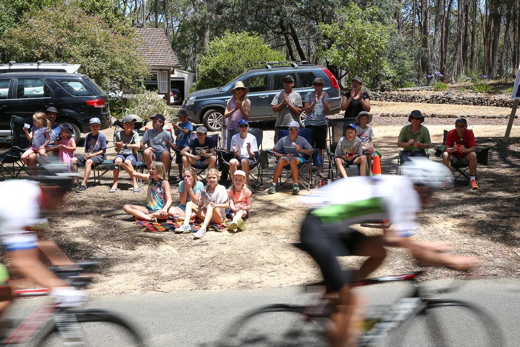 Fans watch the race go by
