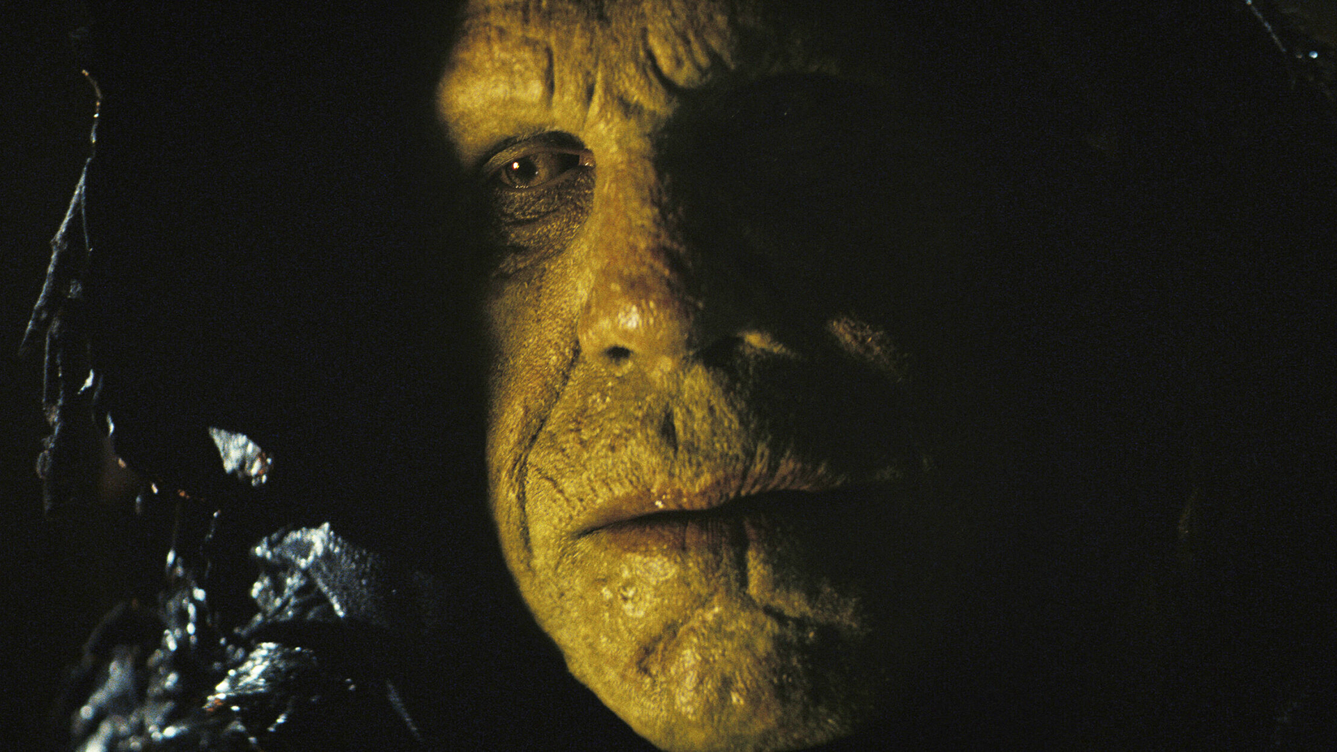 A close-up of a cloaked super mutant's face in Fallout season 2 episode 6