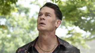 Peacemaker in Alt-Universe looking up worriedly in Peacemaker Season 2