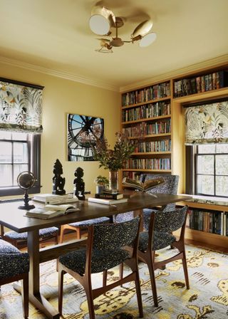 home office color drenched in yellow with built-in bookcase