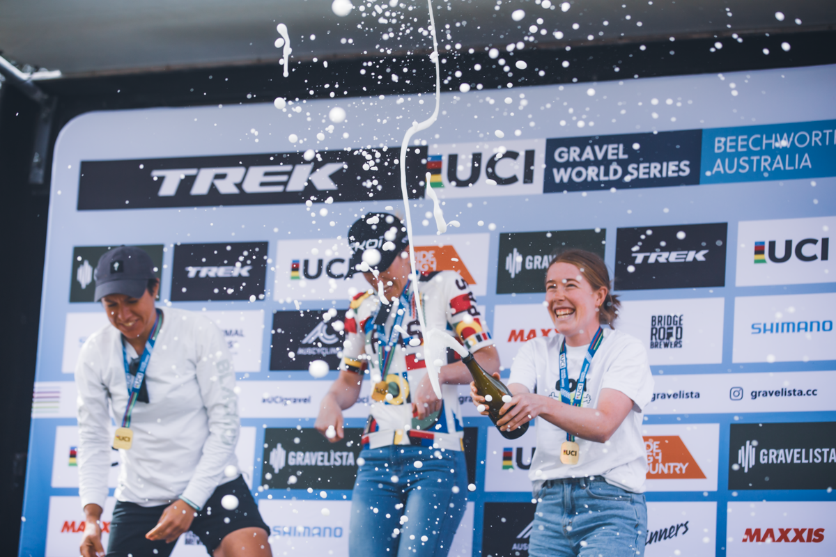 Podium celebrations for Courtney Sherwell, Matilda Raynolds and Cassia Boglio at the Gravelista round of the UCI Gravel World Series race in Beechworth, 2023