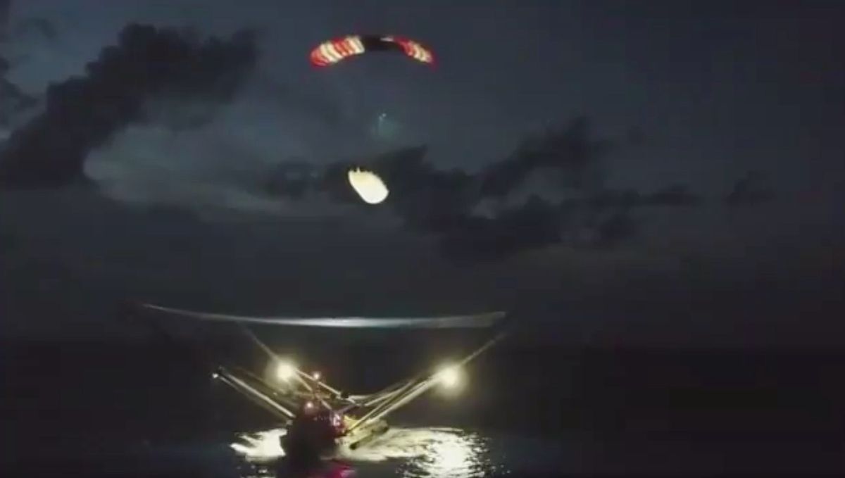 Half of a SpaceX Falcon 9 payload fairing settles into the net of the boat GO Ms. Tree on the night of Aug. 6, 2019, in this screenshot from a video posted on Twitter by SpaceX founder and CEO Elon Musk.