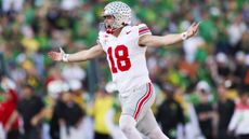 Will Howard (No. 18) of the Ohio State Buckeyes celebrates a touchdown in the first half during the Rose Bowl against Oregon Ducks at Rose Bowl Stadium on January 1, 2025 in Pasadena, California.