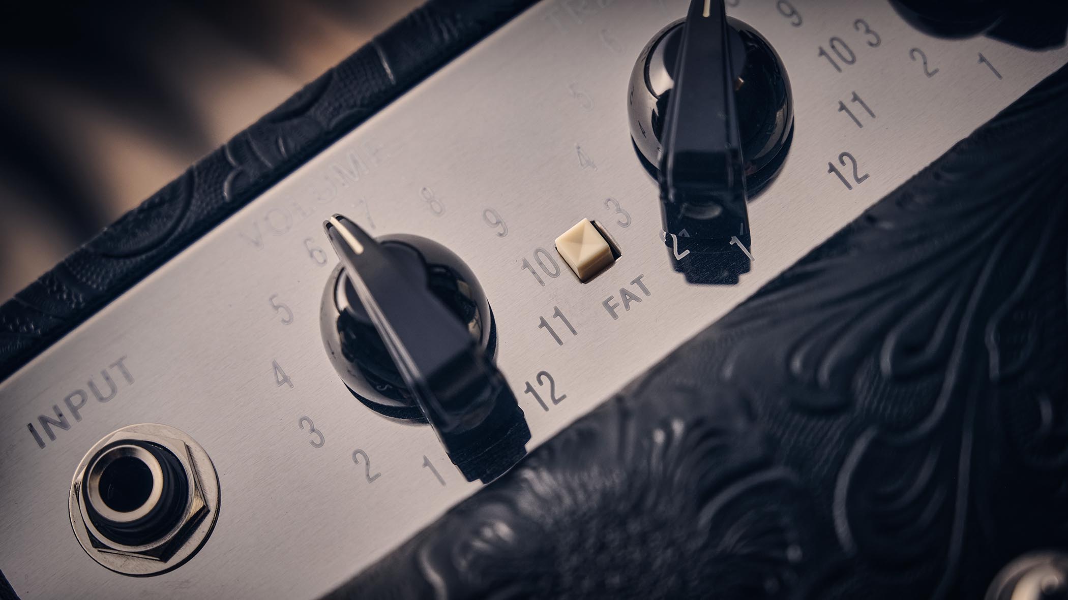 Fender Blues Junior IV 30th Anniversary: the classic combo is refinished with a touch of cowboy western flair, and is here photographed against some weathered floorboards in close-up
