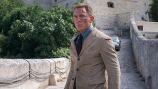 James Bond (Daniel Craig) in a tan suit in a scene from "No Time to Die"