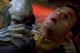 The moment Borg assimilation begins. Nanobots are injected into an Enterprise crewmember in "Star Trek: First Contact"