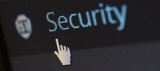 Computer screen displaying the word "Security" with a cursor pointing at it.
