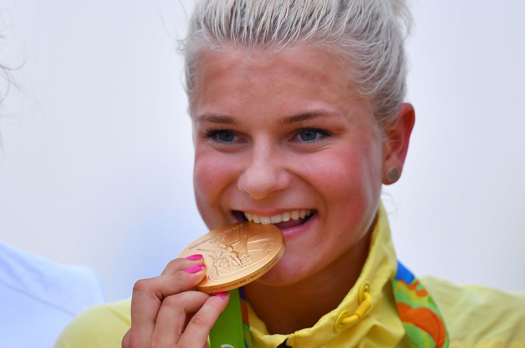 Jenny Rissveds (Sweden) takes a bite out of her gold