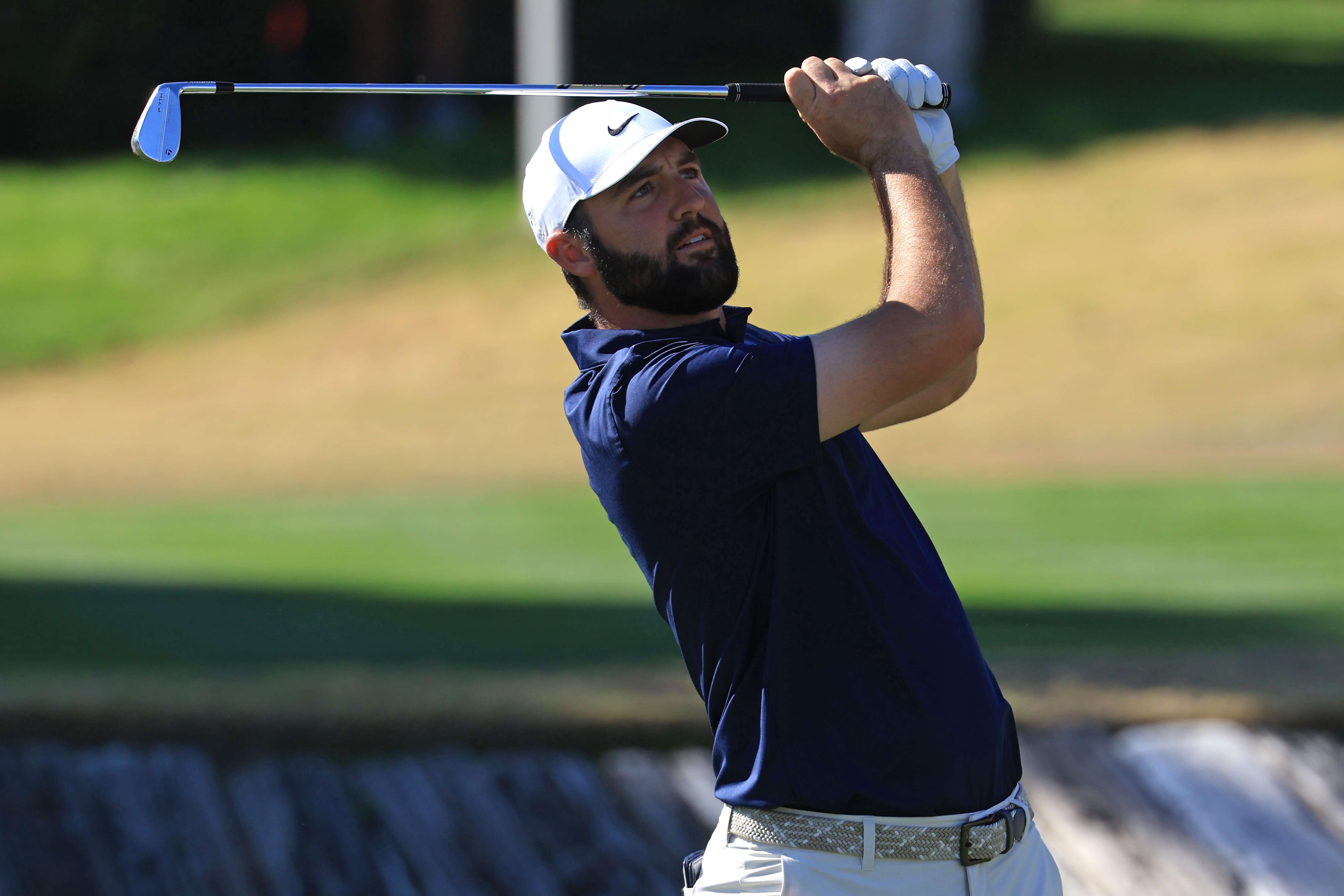 Scottie Scheffler hits an iron from the fairway
