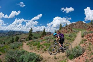 A mountain biker flies down smooth, fast singletrack in Sun Valley, Idaho