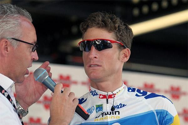 Swiss rider Martin Elmiger, interviewed by race announcer Georges Luchinger