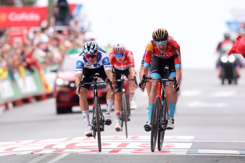 GUADARRAMA SPAIN SEPTEMBER 16 LR Remco Evenepoel of Belgium and Team Soudal Quick Step Polka dot Mountain Jersey and Wout Poels of The Netherlands and Team Bahrain Victorious sprint at finish line to win the stage during the 78th Tour of Spain 2023 Stage 20 a 2078km stage from Manzanares El Real to Guadarrama UCIWT on September 16 2023 in Guadarrama Spain Photo by Alexander HassensteinGetty Images