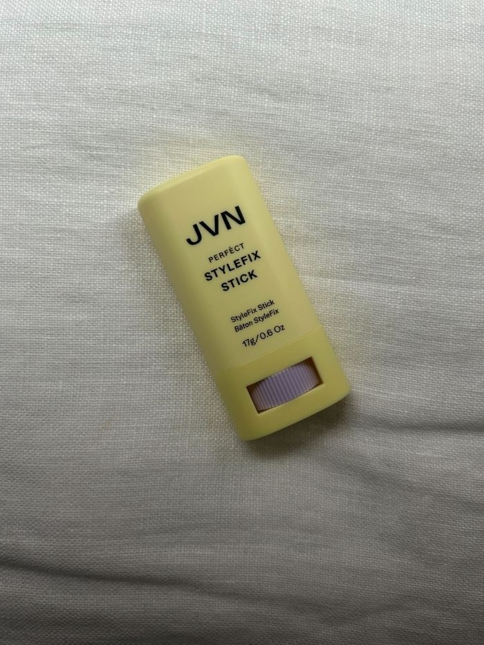 The JVN Hair Perfect StyleFix Stick on a white linen background