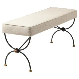 A metal bench with a white upholstered cushion from 1stDibs