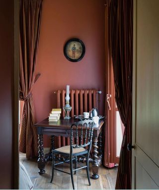 Terracotta room with vintage desk