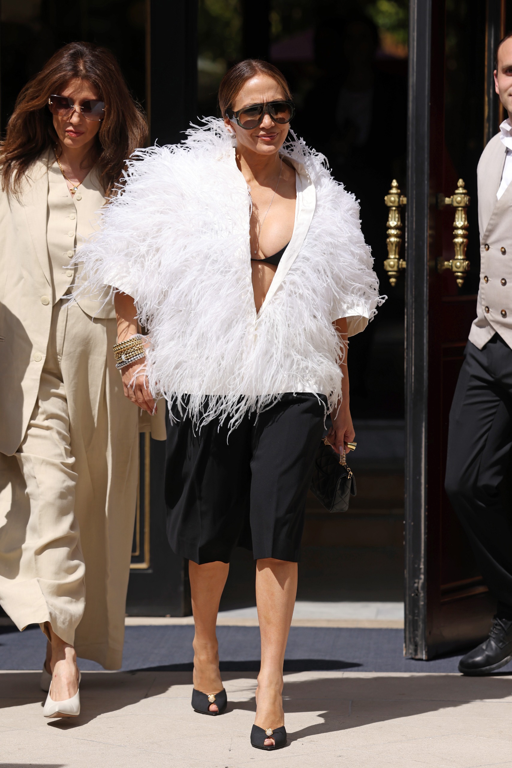 Jennifer Lopez wore the peekaboo bra trend with Bermuda shorts at Paris Couture Week in July 2026