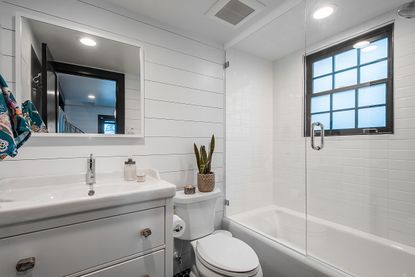 a modern white bathroom with vanity