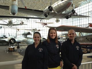 The three remaining finalists in Space Race 2012 — from left, Sara Cook, Lauren Furgason and Gregory Schneider — pose at Seattle's Museum of Flight on May 8, 2012.