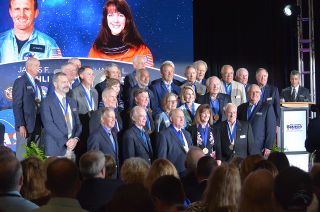 New inductees Jim Buchli and Janet Kavandi stand among fellow U.S. Astronaut Hall of Fame members following their induction ceremony on Saturday, April 6, 2019, at NASA’s Kennedy Space Center Visitor Complex in Florida.