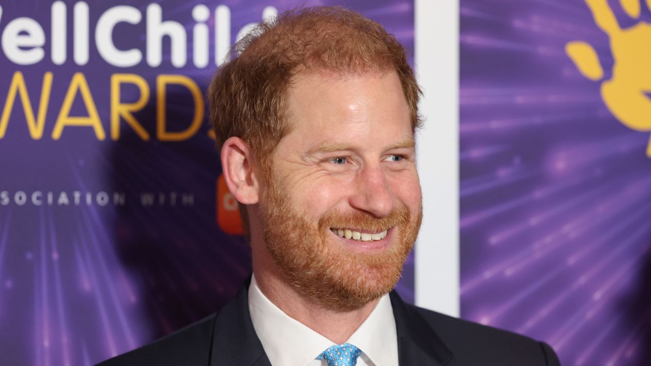 Prince Harry smiles while wearing a suit to attend the Wellchild Awards 2024 at the Royal Lancaster Hotel in London on September 30, 2024