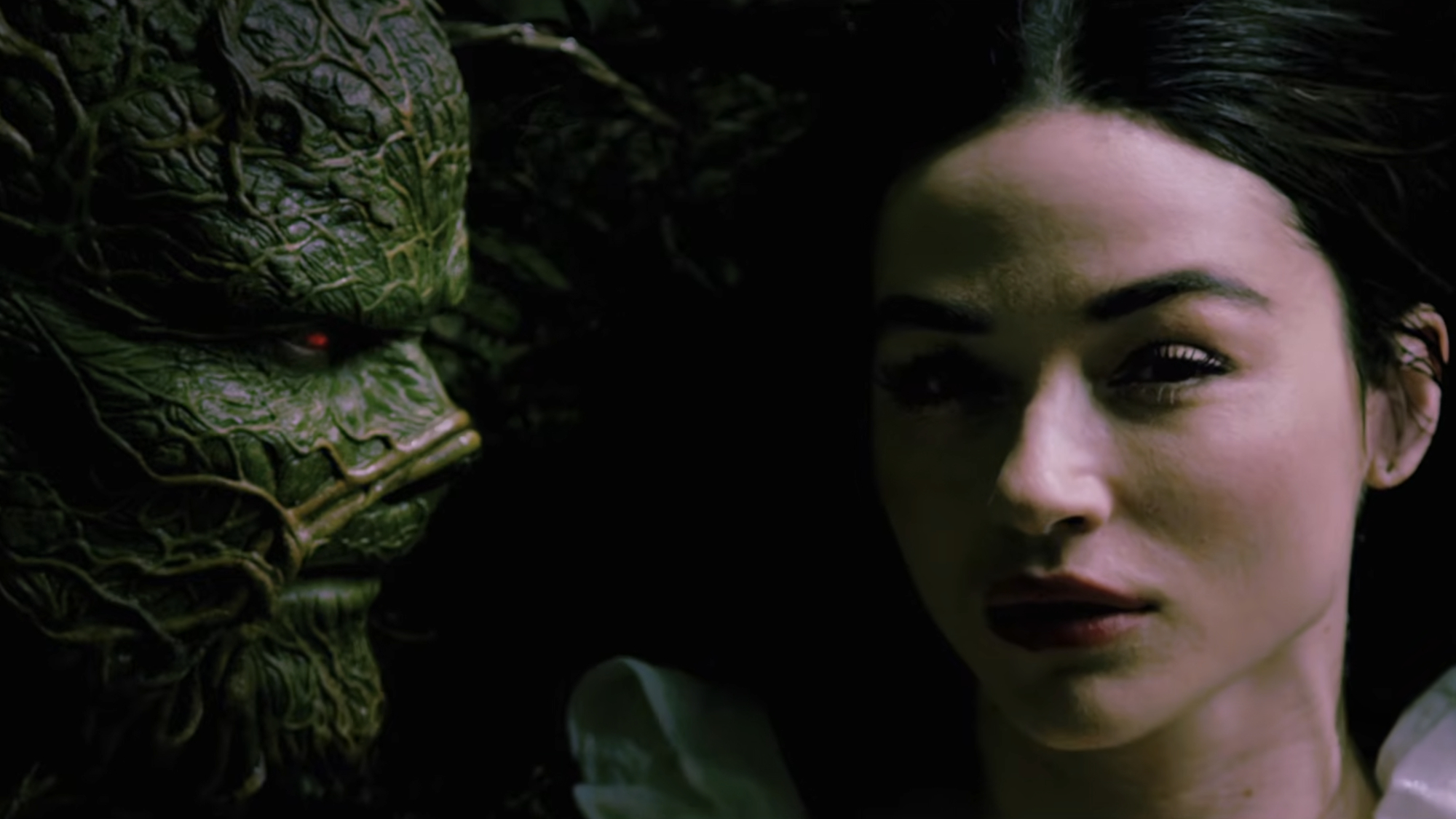 Swamp Thing and Abby Arcane (Crystal Reed) embrace on Swamp Thing.