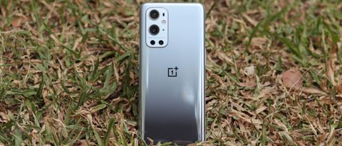 A OnePlus 9 Pro from the back, stood in some grass