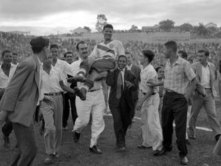 Joe Gaetjens is carried off by cheering fans after scoring the winner for USA against England in Belo Horizonte at the 1950 World Cup.