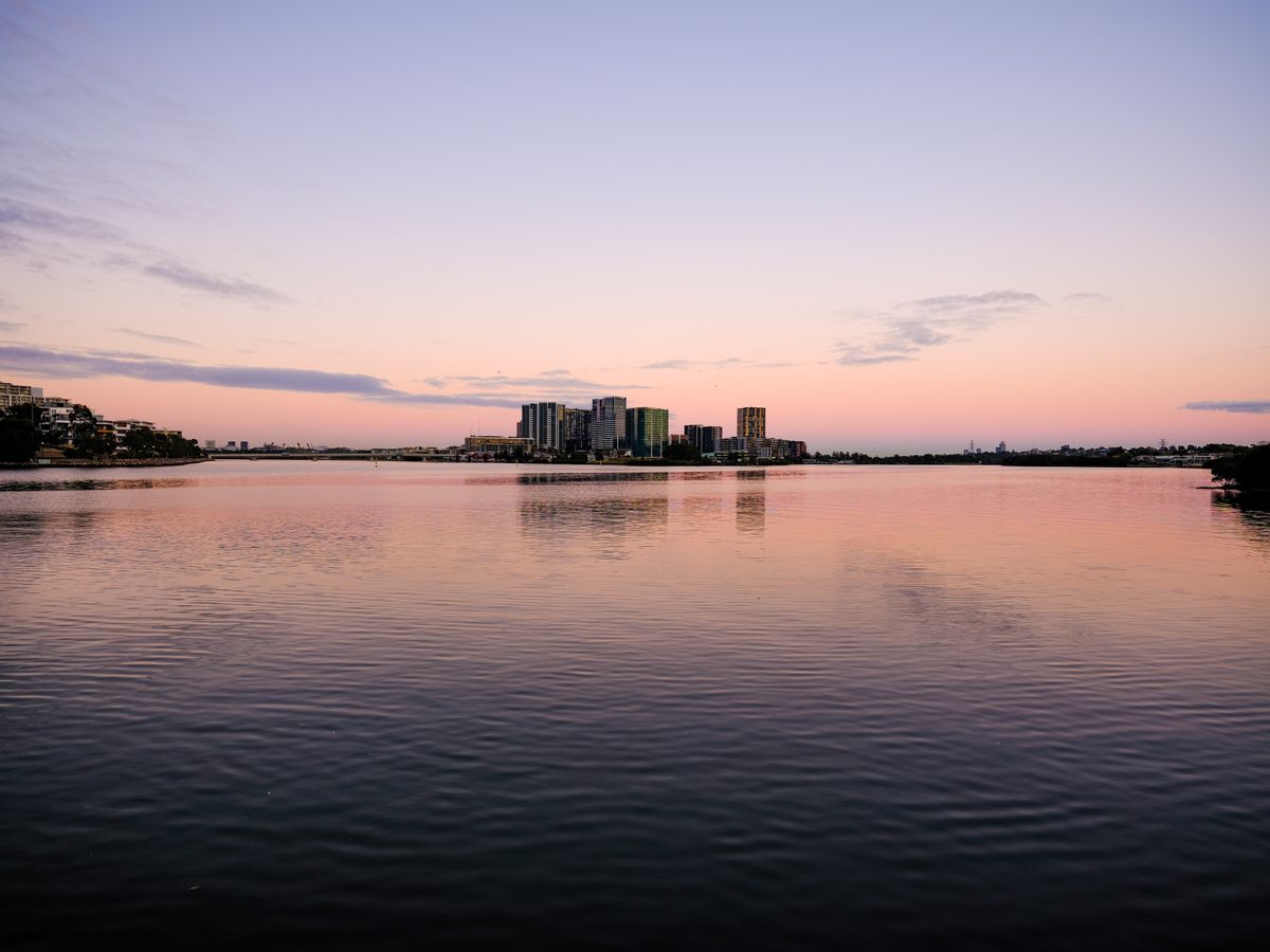 Fujifilm GFX50S II sample shot &ndash; distant buildings and a river at sunrise