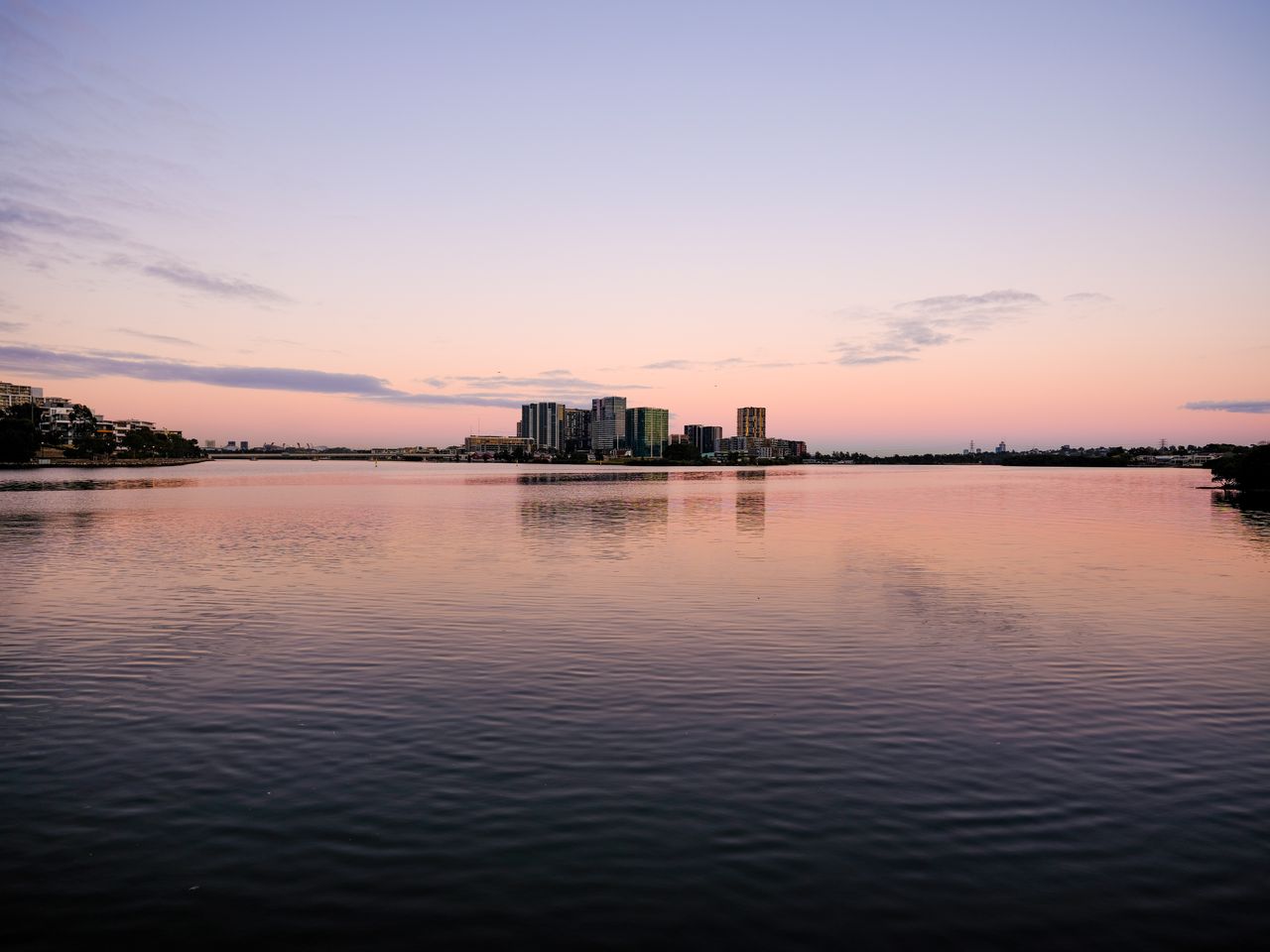 Fujifilm GFX50S II sample shot &ndash; distant buildings and a river at sunrise