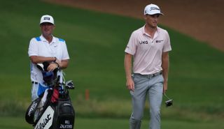 Zalatoris walks with his caddie