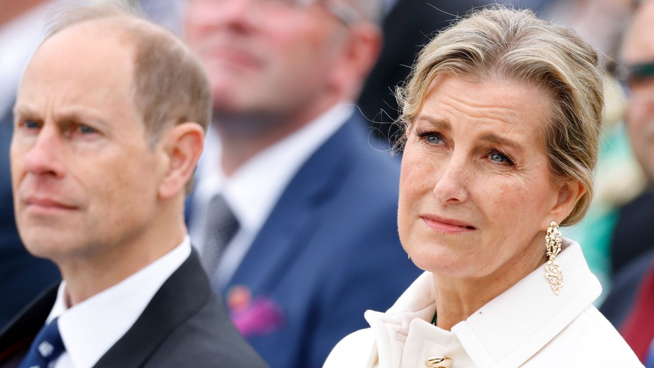 Duchess Sophie wears a white jacket and looks like she is about to cry