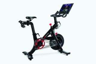 best exercise bikes for indoor cycling includes this Peloton bike in the image with is front pointing to the right