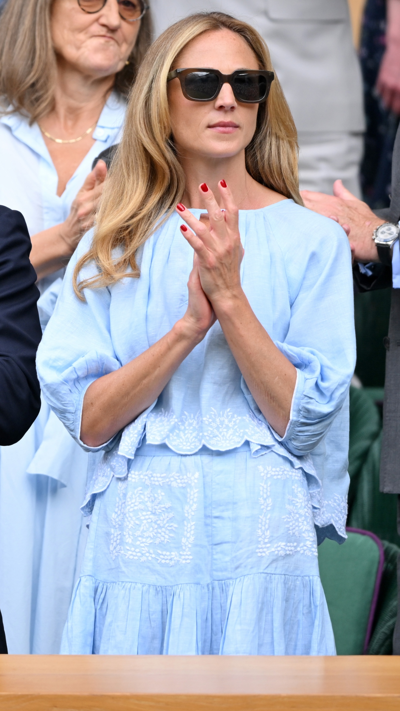 Harriet Phillips claps as she attends day ten of the Wimbledon Tennis Championships at the All England Lawn Tennis and Croquet Club on July 09, 2025