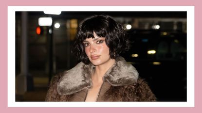 the new emily ratajkowski haircut, a bob and bangs, which she wore with a neutral-colored outfit to marc jacobs fashion week show