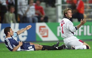 English midfielder David Beckham (R) and Argentinan captain Diego Simeone (L) react after foul play by Beckham during the 1998 Soccer World Cup second round match between Argentina and England, 30 June at Geoffroy Guichard stadium in Saint-Etienne, central France. Beckham was sent off the pitch after getting a red card by Danish referee Kim Milton Nielsen. (ELECTRONIC IMAGE) AFP PHOTO (Photo credit should read GERARD CERLES/AFP via Getty Images)