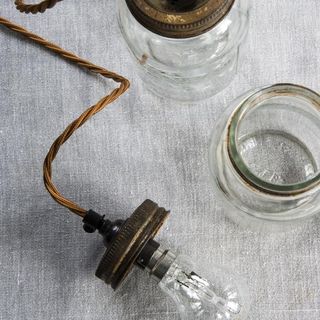 glass jar with bulb and rustic wires