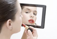 Marie Claire Issues and Campaigns: Woman putting on make-up