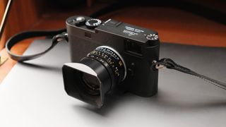 Leica M11-P camera on top of a closed laptop