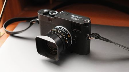 Leica M11-P camera on top of a closed laptop