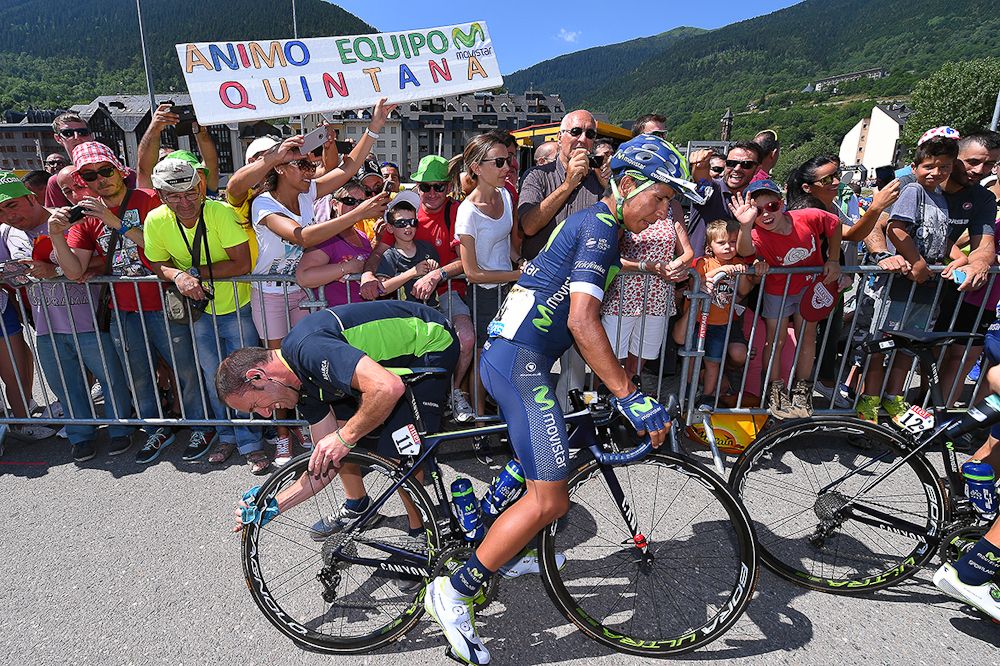 Nairo Quintana gets some last-minute prep on his rear wheel before the start of stage 9