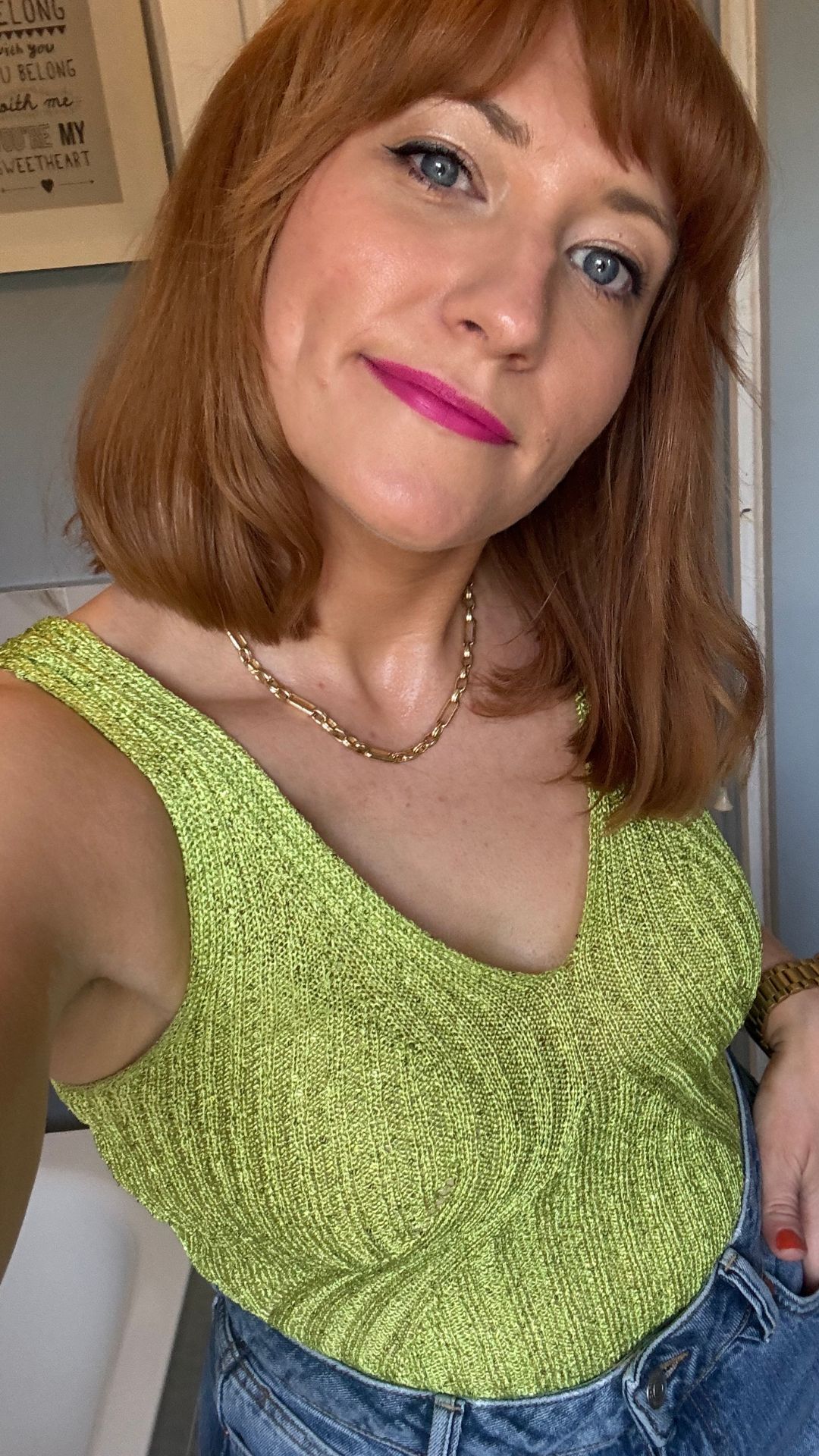 matilda wearing a lime green vest and jeans outfit