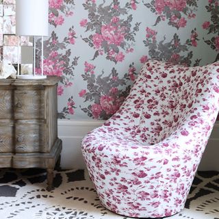 living room with floral printed wallpaper on wall