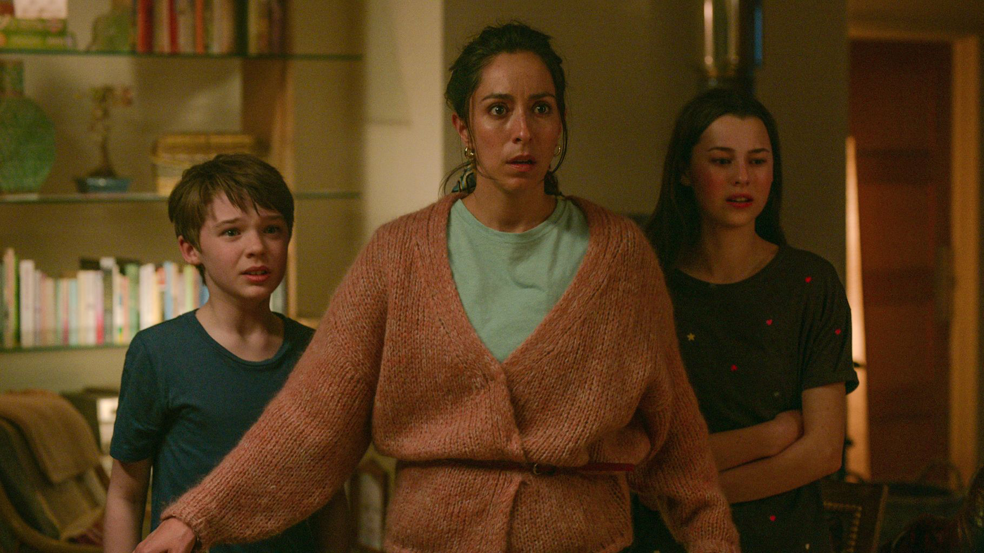 Maddy and her kids look shocked at something off screen in Netflix's Treason TV series