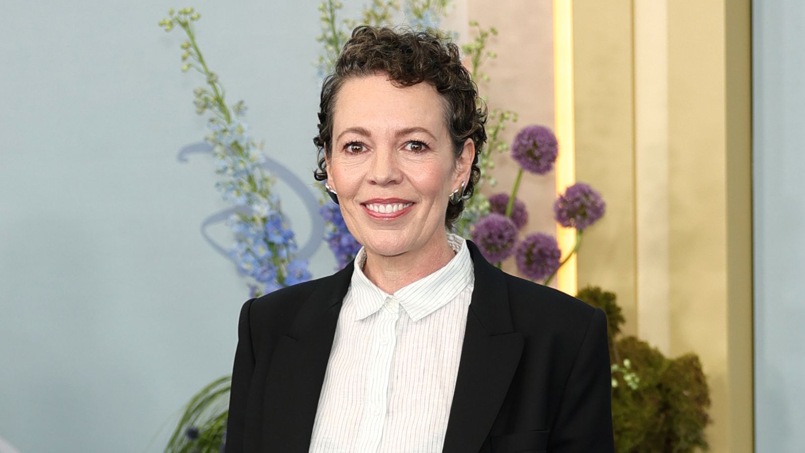 Olivia Colman in white shirt and black blazer