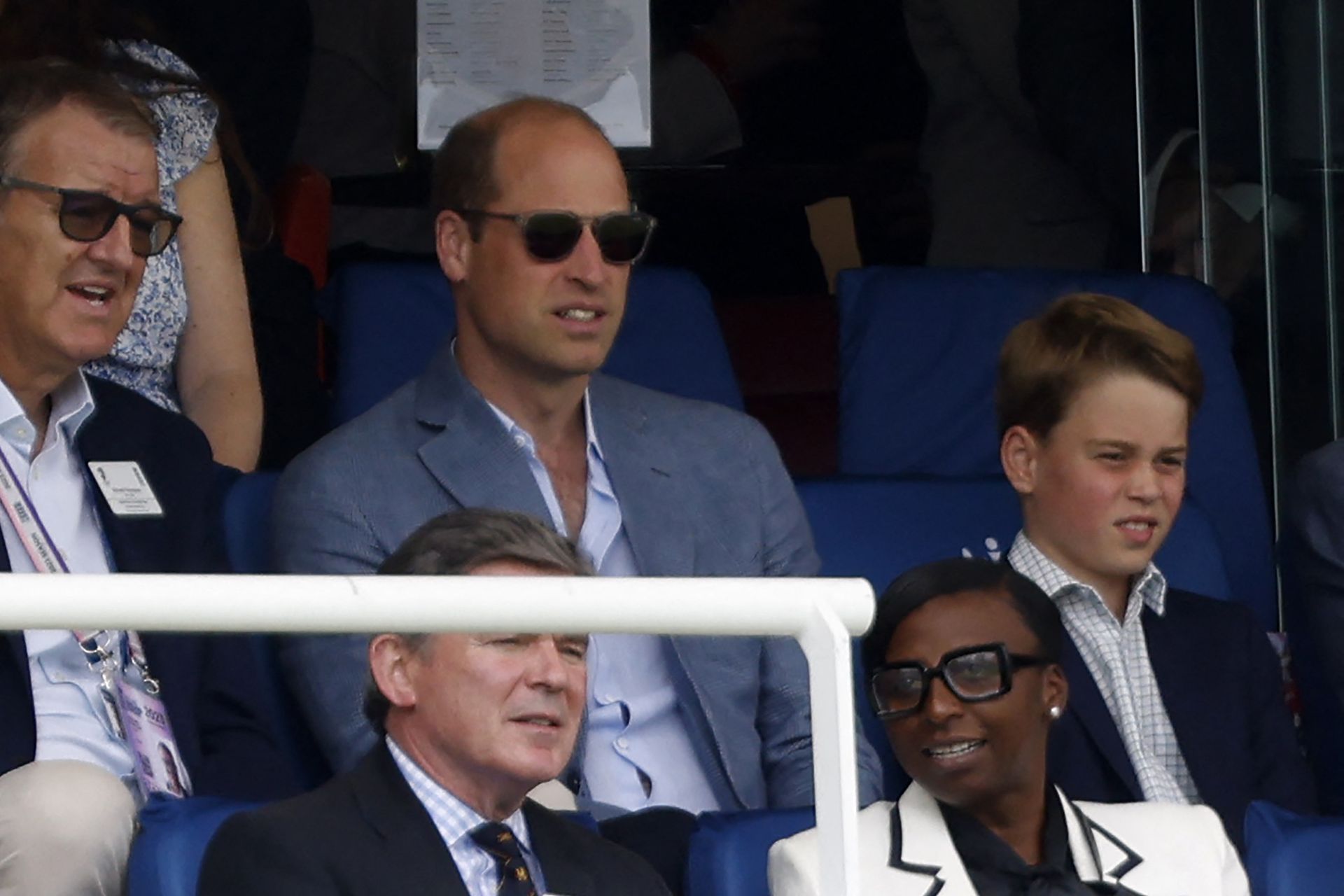 Prince William and Prince George interact at a cricket match