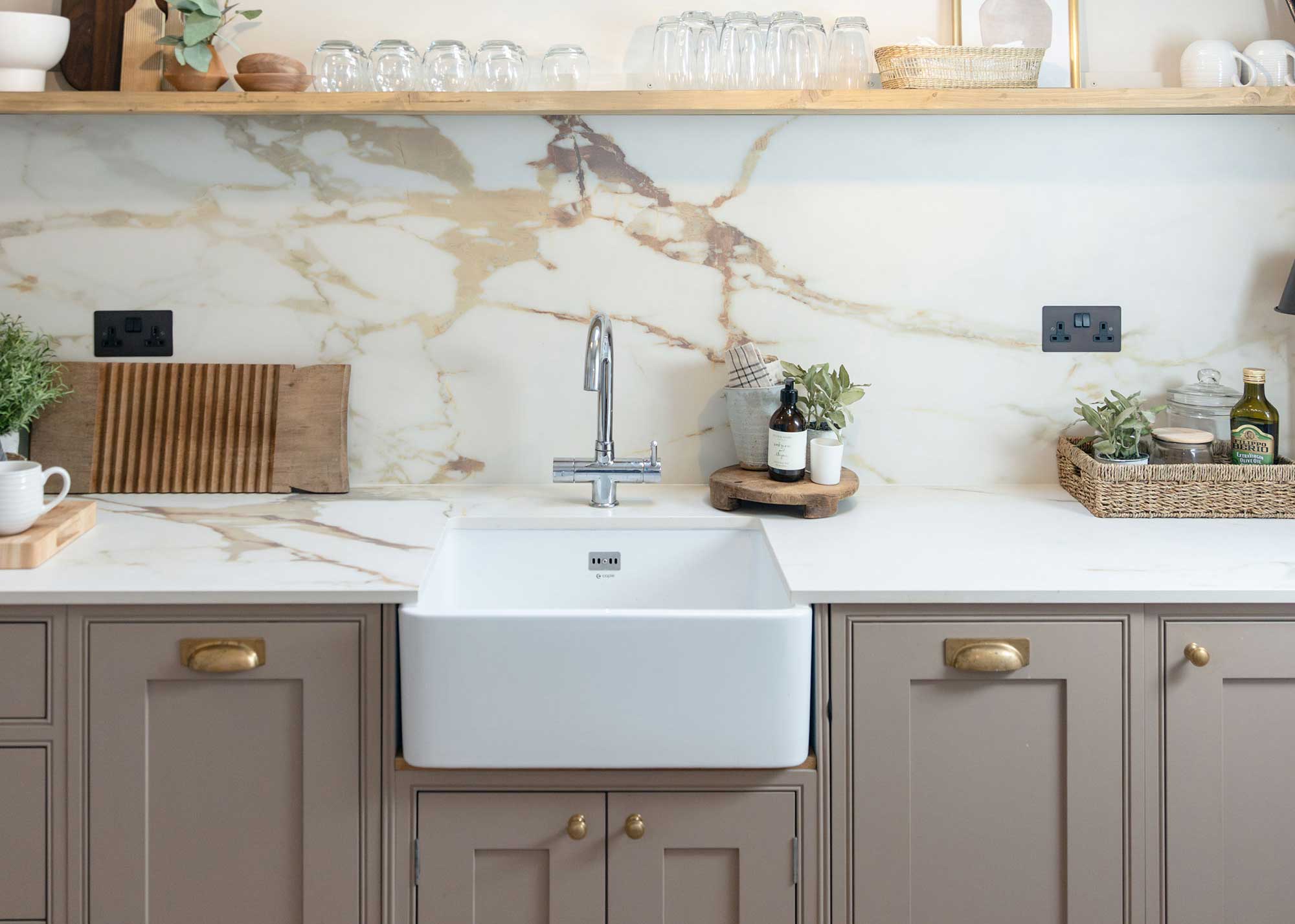 pale brown Shaker kitchen with marble splashback