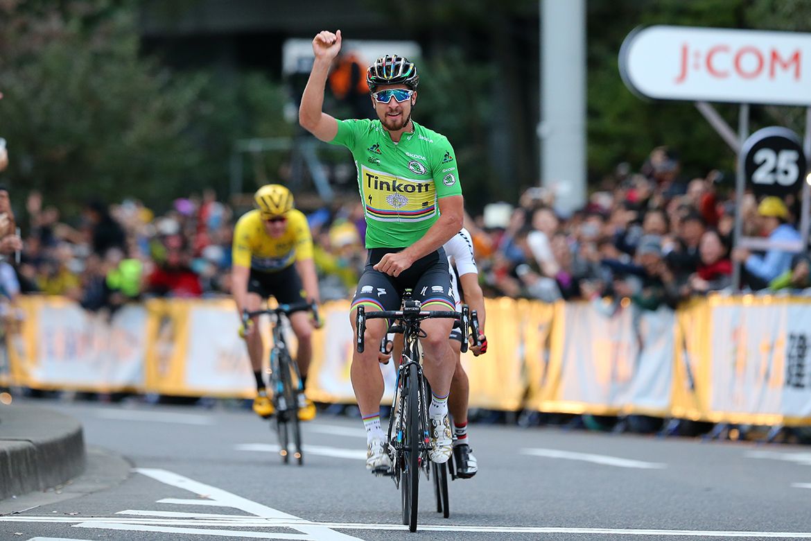 Sagan raises his arm in celebration
