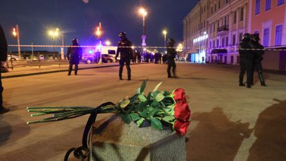 Flowers outside the cafe in St Petersburg where Vladlen Tatarsky was killed on Sunday, 2 April 2023