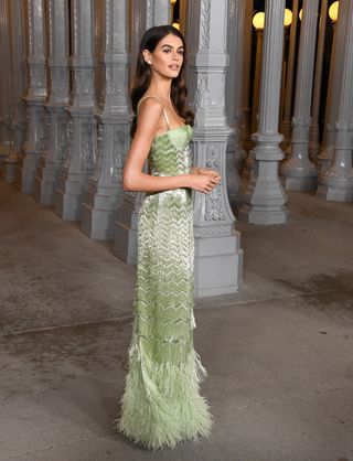 Kaia gerber attends the LACMA gucci gala in a green fringe dress